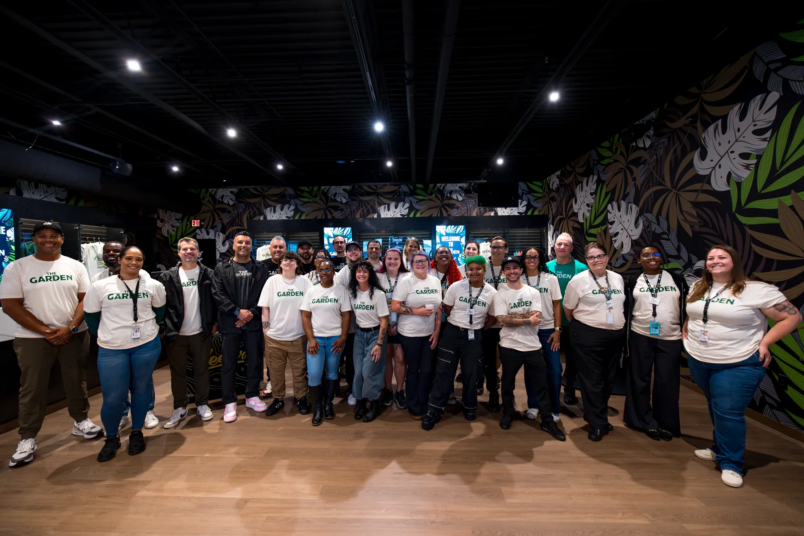 The Garden opening crew in cream Garden tees on the sales floor